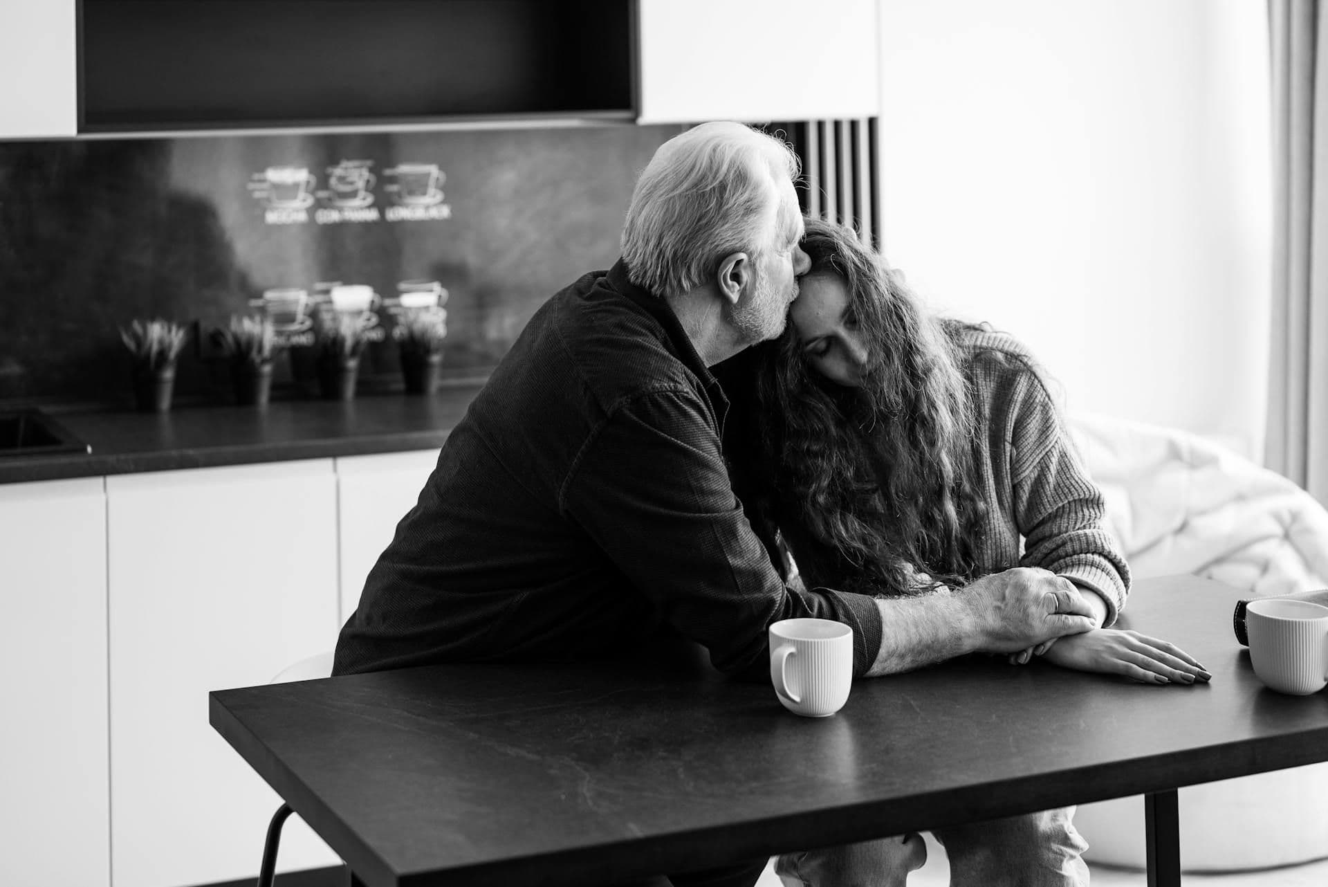 a father consoling his daughter