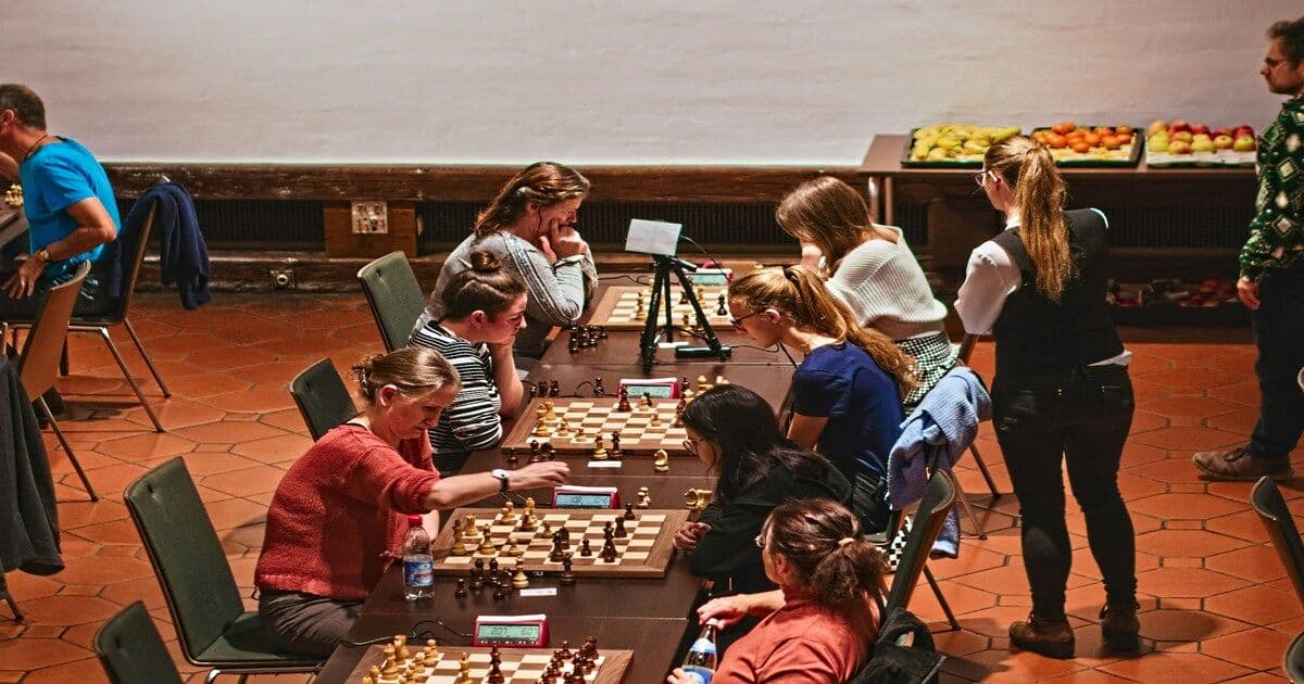 A group of students sitting together and playing games