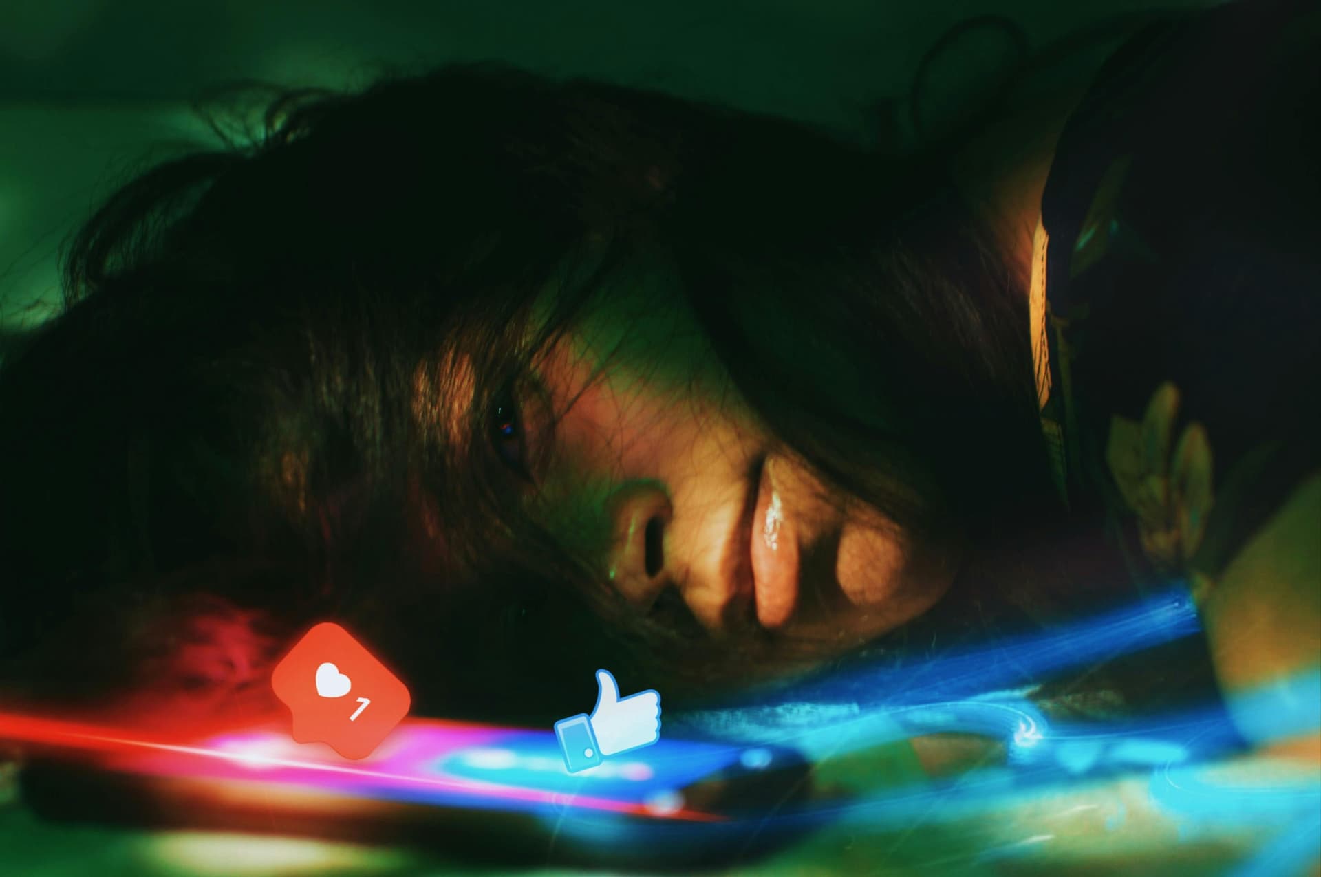 A girl looking sad while looking at her phone.