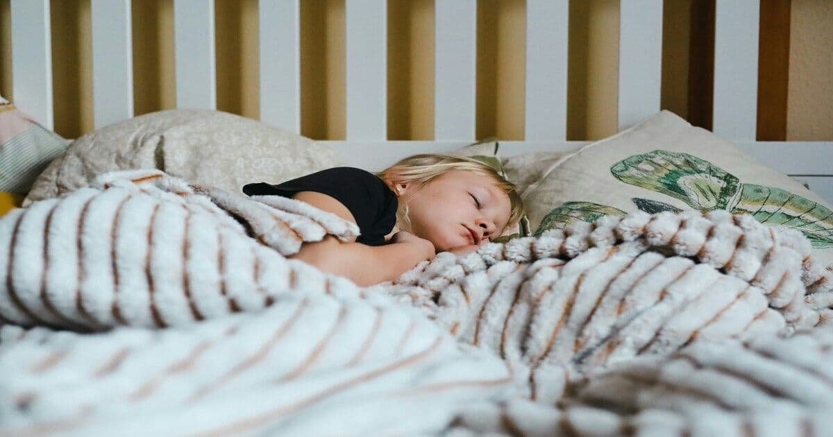 A man sleeping peacefully, illustrating the importance of rest for calming the mind and reducing worry